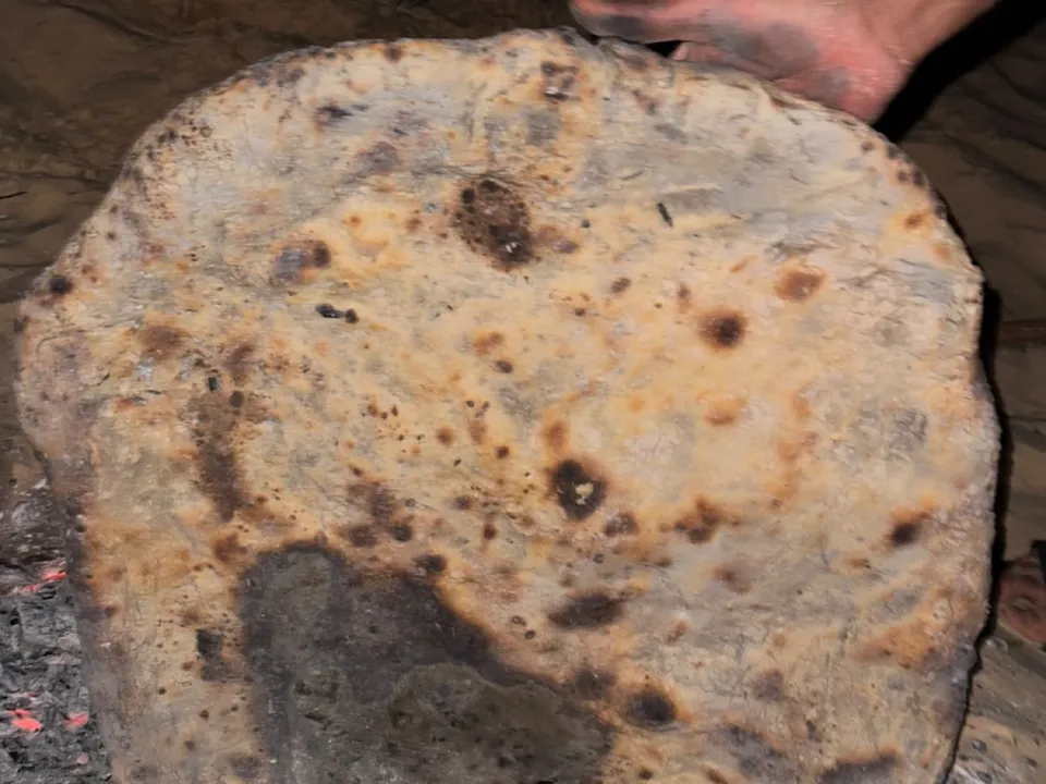 Sand-baked bread held up after baking